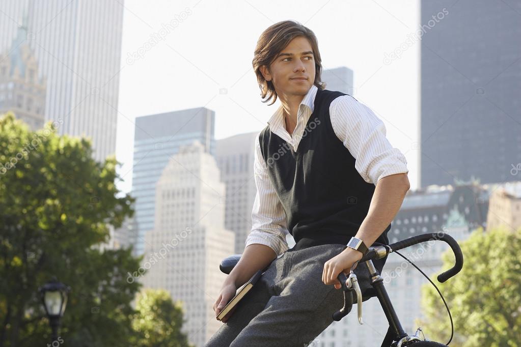 Man leaning on bicycle