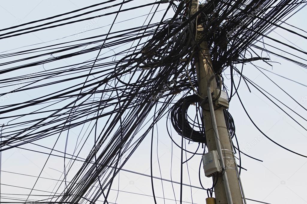 Tangle of Electrical Wires on Power Pole