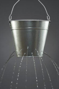Water leaking from bucket clipart