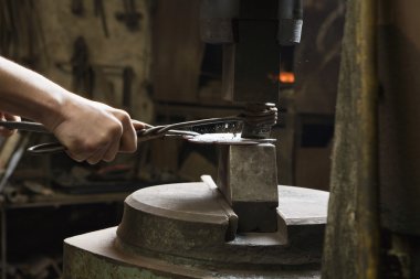 Blacksmith Shaping Metal