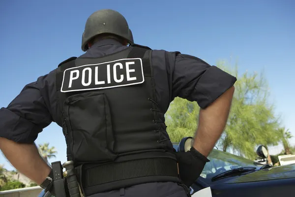 Police officer in bulletproof vest outdoors — Stock Photo, Image