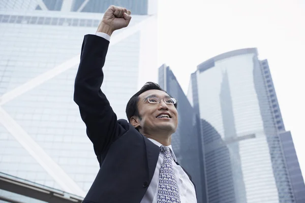Businessman with risen fist — Stock Photo, Image