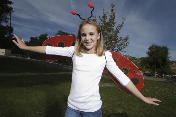 Girl wearing ladybug costume — Stock Photo, Image