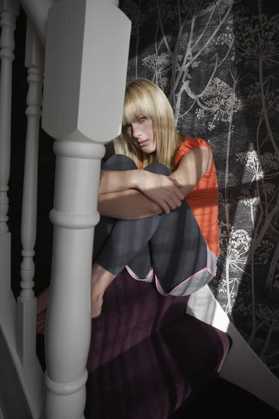 Girl sitting on stairs — Stock Photo, Image