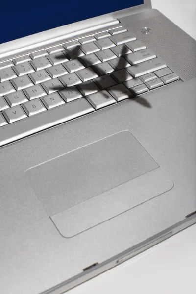 Shadow of jumbo jet over keyboard — Stock Photo, Image