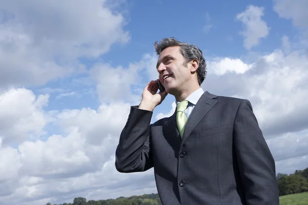 Businessman talking on phone — Stock Photo, Image