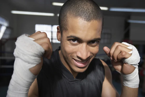 Man wearing wristbands in fighting stance — Stock Photo, Image