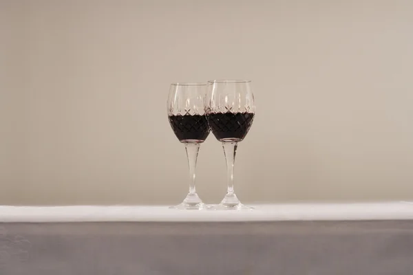 Glasses of red wine on table — Stock Photo, Image