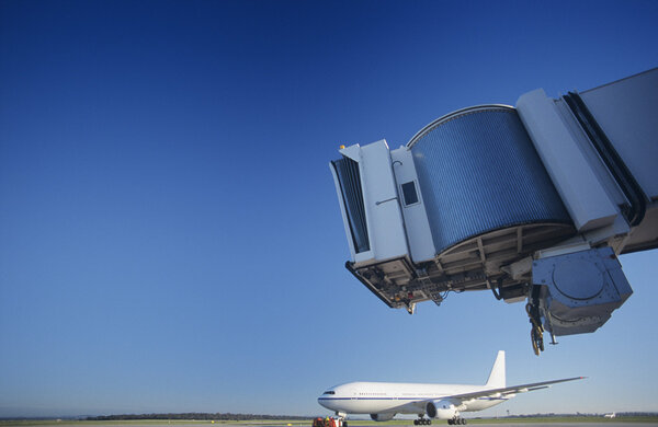 Bridge and airplane at airport