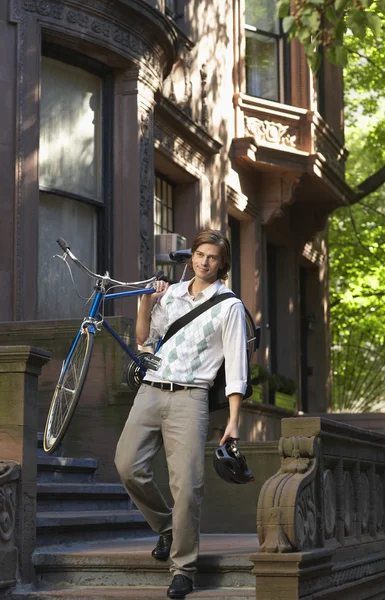 Man carrying bicycle — Stock Photo, Image