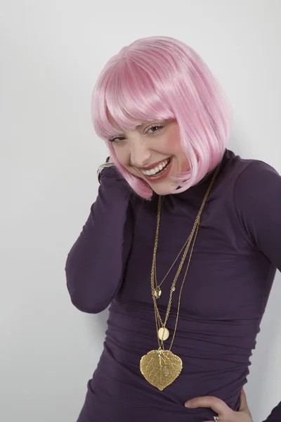 Woman wearing pink wig — Stock Photo, Image