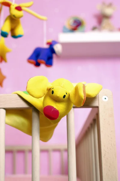 Crib with toys — Stock Photo, Image