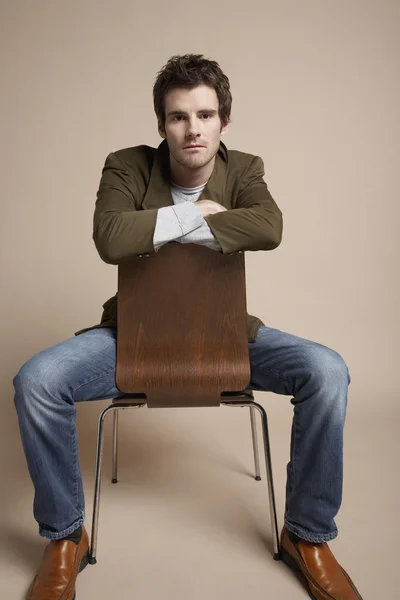 Man sitting on chair — Stock Photo, Image