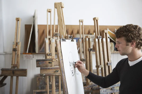 Artist drawing charcoal portrait — Stock Photo, Image