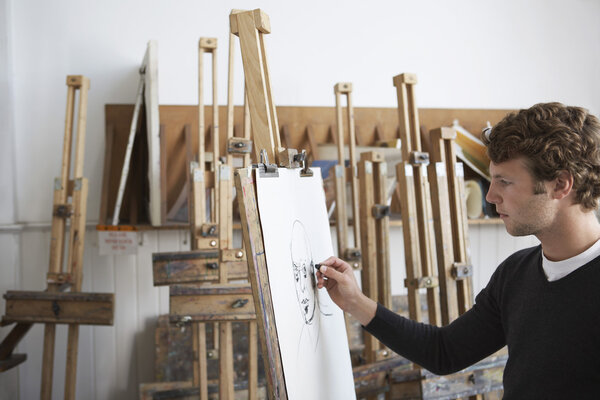 Artist drawing charcoal portrait