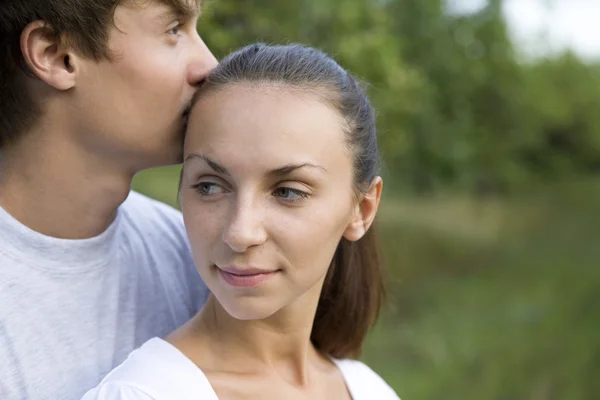 Couple embracing in orchard — Stock Photo, Image