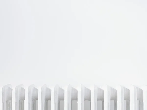 Radiator against white wall — Stock Photo, Image