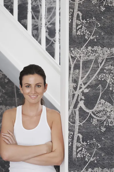 Woman  leaning against staircase — Stock Photo, Image