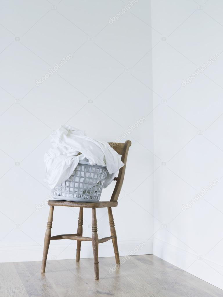 Laundry basket on chair