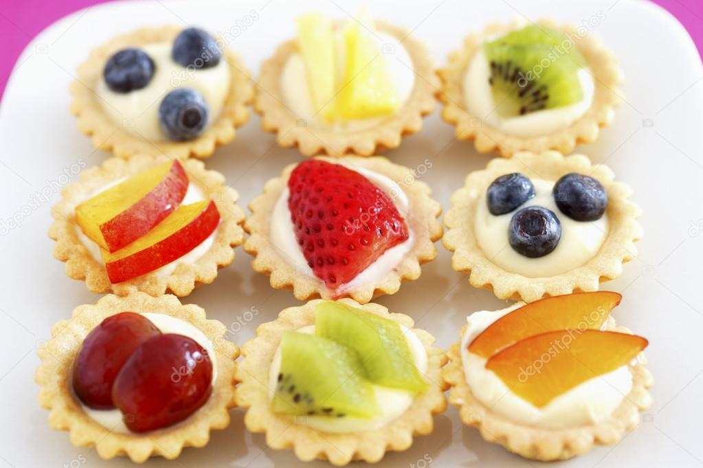 Selection of mini fruit cupcakes — Stock Photo © londondeposit 33893919