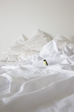 Bed with toy penguin clipart