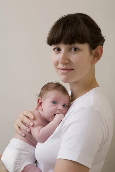 Mother hugging her newborn baby — Stock Photo, Image