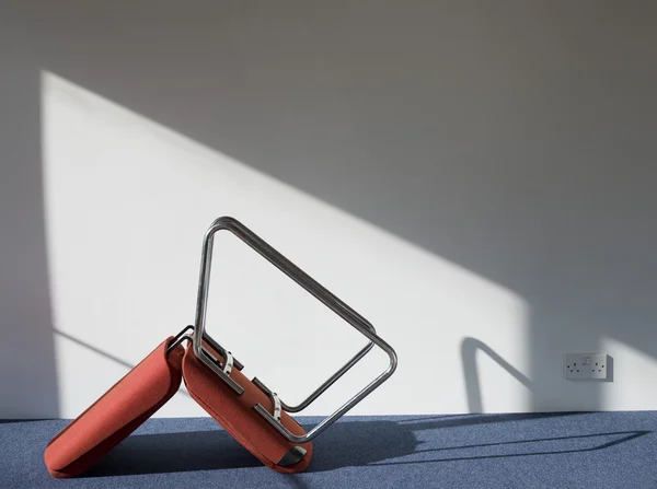 Upturned office chair — Stock Photo, Image