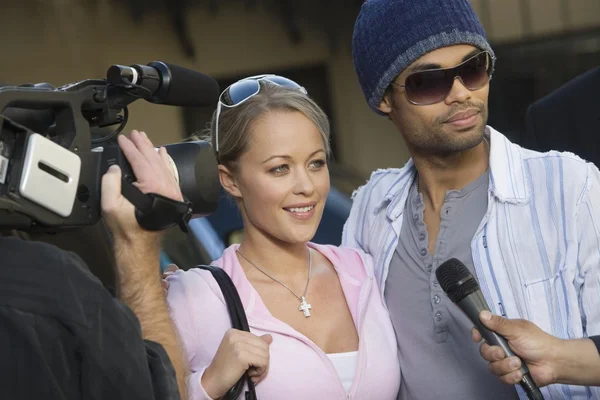 Celebrity couple being interviewed — Stock Photo, Image