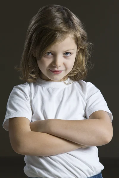 Girl standing with arms crossed — Stock Photo, Image