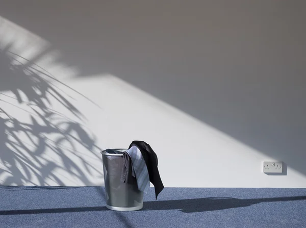 Suit in waste bin — Stock Photo, Image