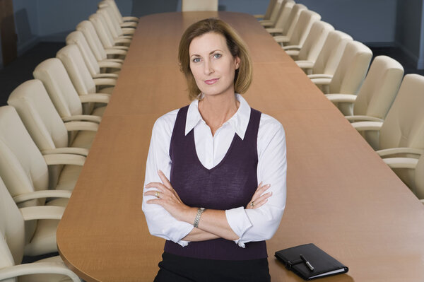 Businesswoman Standing in Meeting Room