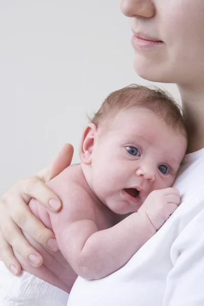 Mother hugging newborn baby — Stock Photo, Image