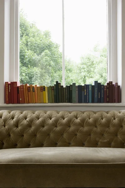 Books on windowsill — Stock Photo, Image