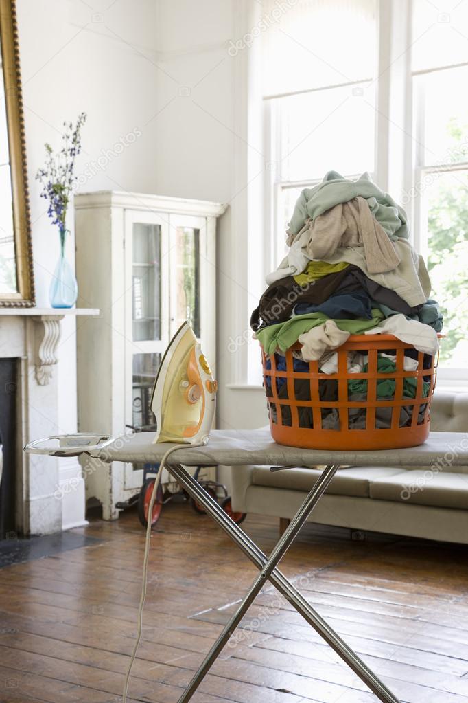 Laundry basket on ironing board
