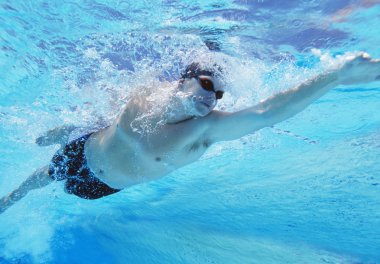 Male athlete swimming in pool