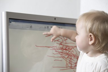 Child drawing on computer clipart
