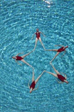 Synchronised swimmers form a star clipart