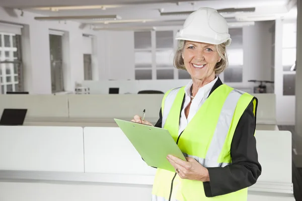 Senior woman in reflector vest — Stock Photo, Image