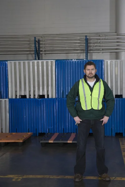 Man standing in factory — Stock Photo, Image