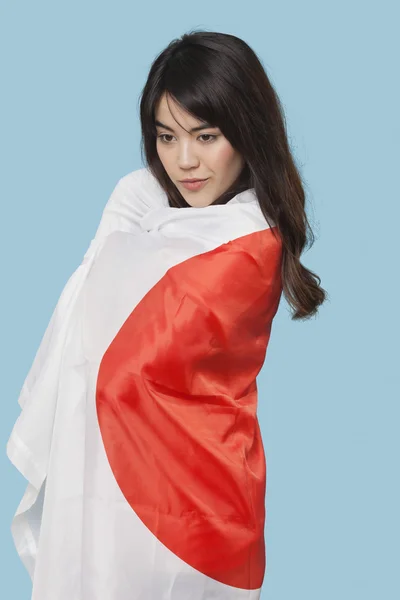 Japon bayrağı sarılı — Stok fotoğraf