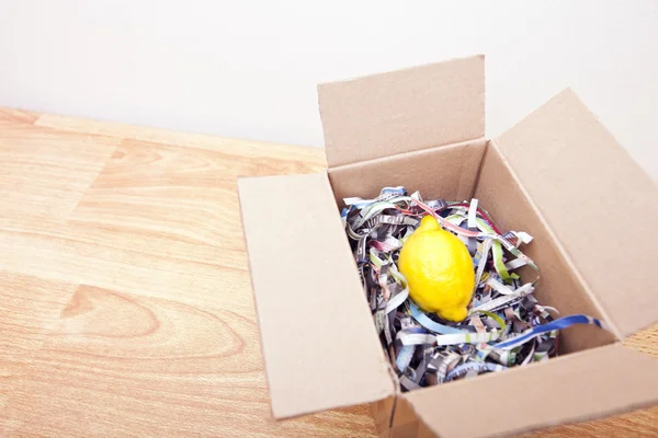 Lemon wrapped up in a box — Stock Photo, Image