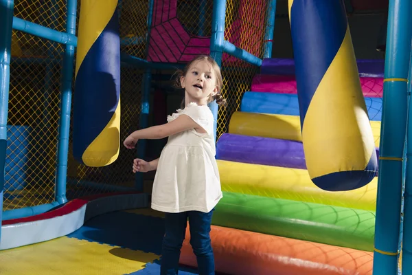 Girl hitting foam object — Stock Photo, Image