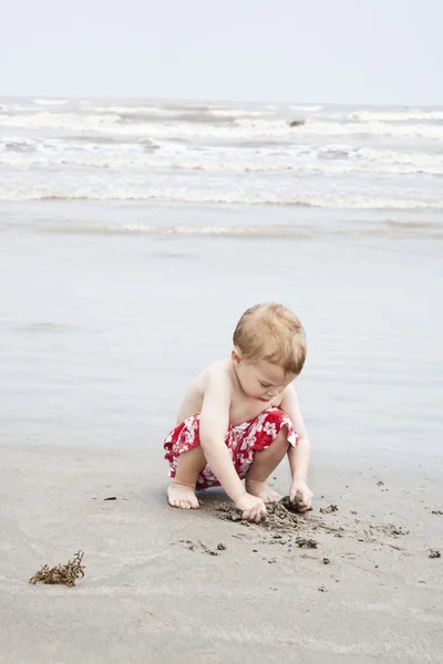Boy on sandy sea coast — Stock Photo, Image