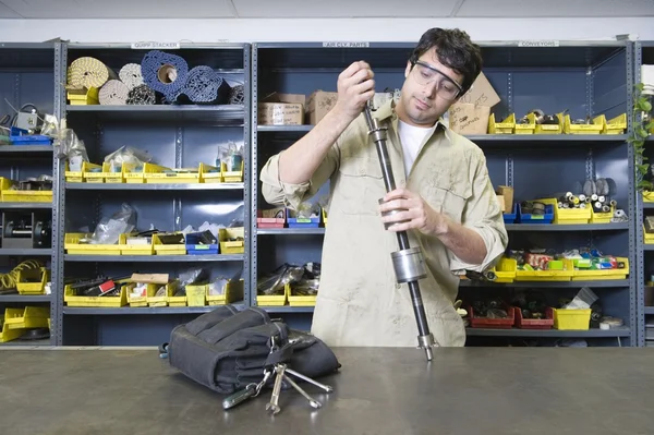 Man in workshop with tools — Stock Photo, Image