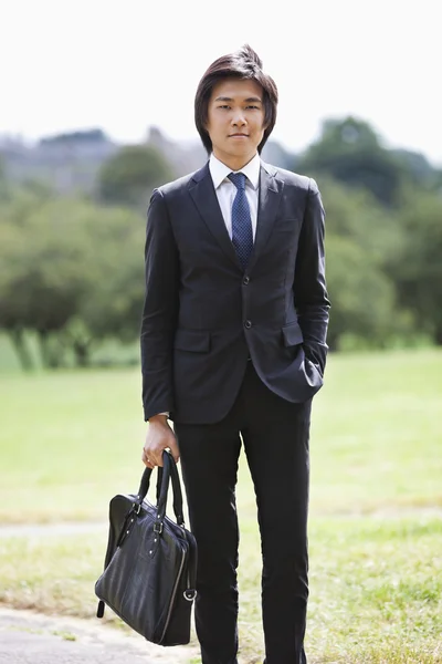 Businessman carrying briefcase — Stock Photo, Image