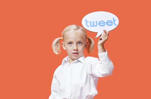 Young girl holding tweet bubble — Stock Photo, Image