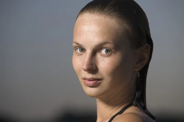 Young woman in swimming costume at dusk — Stock Photo, Image