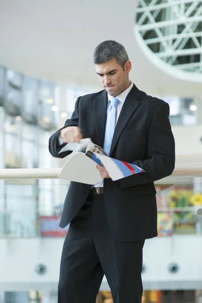 Businessman tearing up a document — Stock Photo, Image