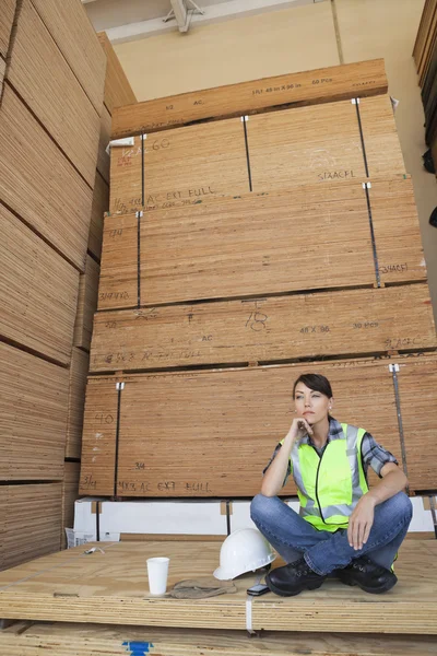 Pensive female industrial worker — Stock Photo, Image