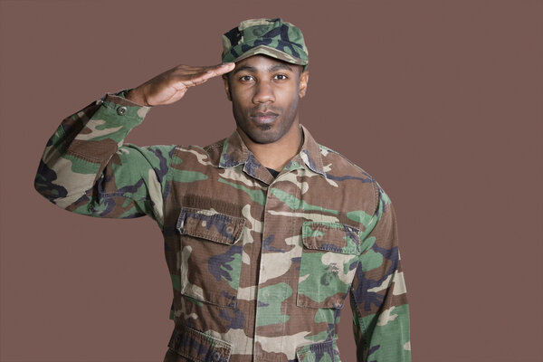African American US Marine Corps soldier saluting Stock Photo